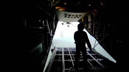 Six 103rd Rescue Squadron pararescue jumpers (PJs) launch from an HC-130 aircraft at the Jones Beach Air Show May 24, 2014.  Piloted by the 102nd RQS, the 103rd PJs completed a 1,500 feet static line drop from the HC-130. 
