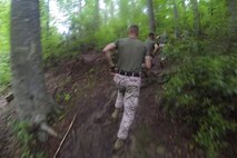 Marines with Combat Logistics Battalion 6, Combat Logistics Regiment 2, 2nd Marine Logistics Group run the endurance course at The Basic School in Quantico, Va., May 14, 2014. More than 30 of the battalion’s noncommissioned officers ran the course as part of a week-long leadership class that included a tour of the school and the reading of Medal of Honor citations during the course.