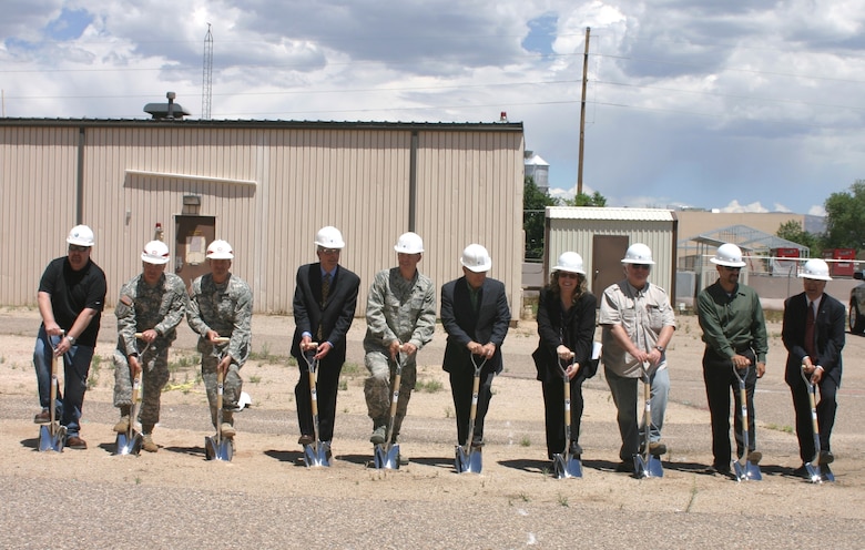 KIRTLAND AIR FORCE BASE, N.M., -- The District participated in breaking ground on the FY13 Building 909 Lab Space at the base May 28, 2014. Among the AFRL, KAFB, and contractor representatives Deputy District Commander Maj. Gary Bonham, second from left; Kirtland Resident Office Project Officer Capt. John Deal, third from left; and project manager Filemon Gallegos, second from right.