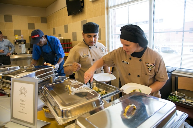 Marine Corps Air Station Beaufort food service specialists compete in the Mess Hall Cook-Off held at the Consolidated Mess Hall on Marine Corps Recruit Depot Parris Island, May 20. To compete in the biannual competition, the Marines needed to complete the Culinary Foundations Course and have one of the top four scores in the class. The Cook-off was held to teach the cooks how to think creatively and use their knowledge to create unique recipes.