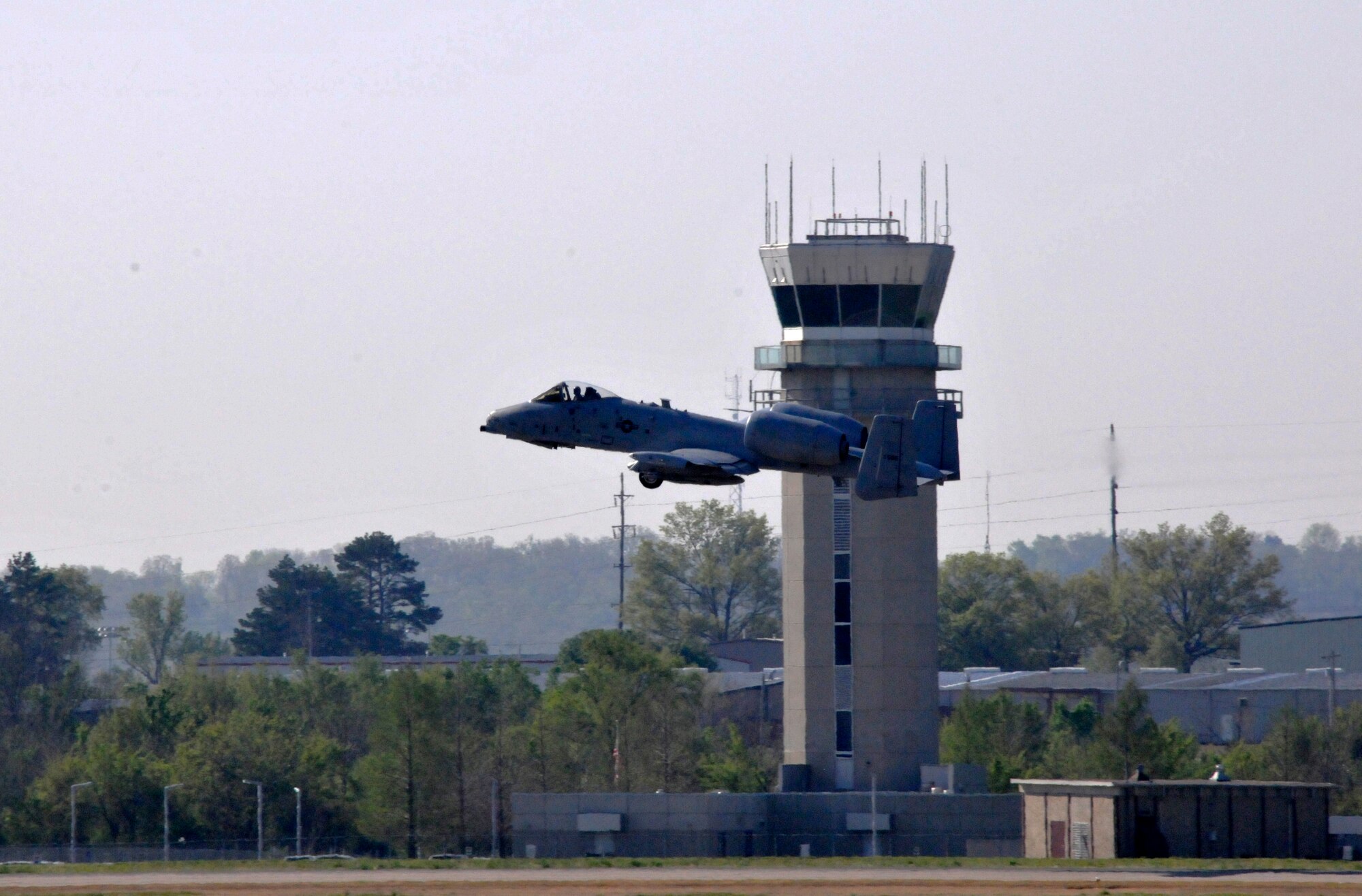Maj. Michael Roche, a pilot with the 76th Fighter Squadron, Moody Air Force Base, Georgia, takes off in an A-10C Thunderbolt II "Warthog" (Tail No. 586). The aircraft left Ebbing Air National Guard Base, Fort Smith, Arkansas en route to Moody Air Force Base, Georgia on April 18, 2014, as part of the 188th's mission conversion. (U.S. Air National Guard photo by Tech Sgt. Josh Lewis/Released)
