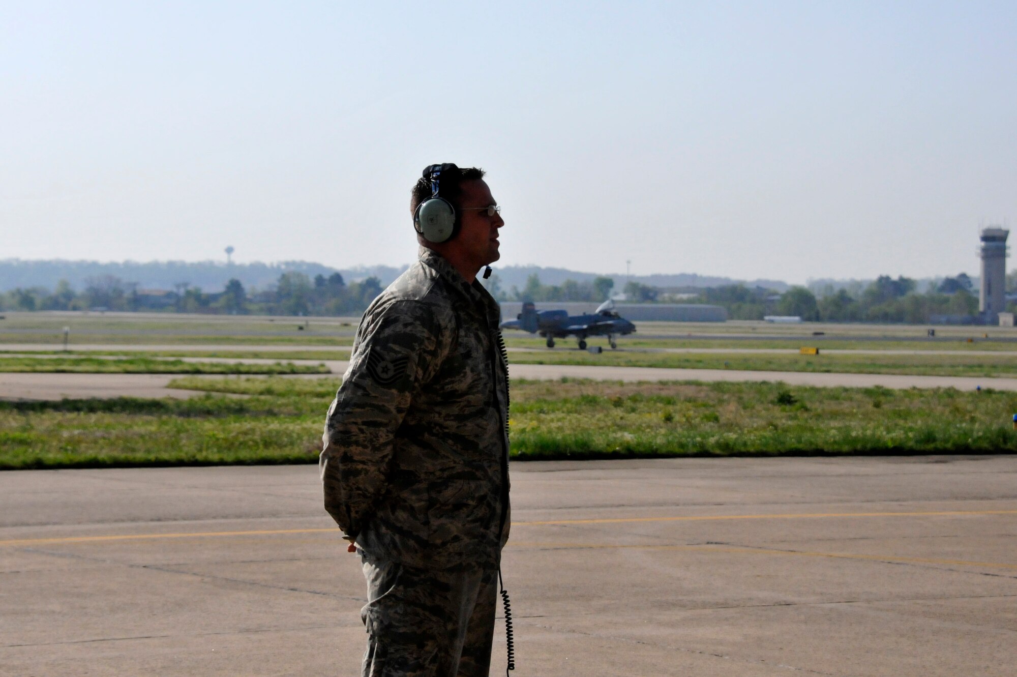 Tech Sgt. Shawn Thorne, a crew chief with the 188th Aircraft Maintenance Squadron, prepares to marshal an  A-10C Thunderbolt II "Warthog" (Tail No. 586). The aircraft left Ebbing Air National Guard Base, Fort Smith, Arkansas. The aircraft was delivered from the 188th Fighter Wing to Moody Air Force Base, Georgia., April 18, 2014, as part of the 188th's mission conversion from the A-10 to a remotely piloted aircraft, intelligence and targeting mission. The 188th has three remaining A-10s on station. The final two aircraft are scheduled to leave the 188th June 7, 2014. (U.S. Air National Guard photo by Tech Sgt. Josh Lewis/Released)