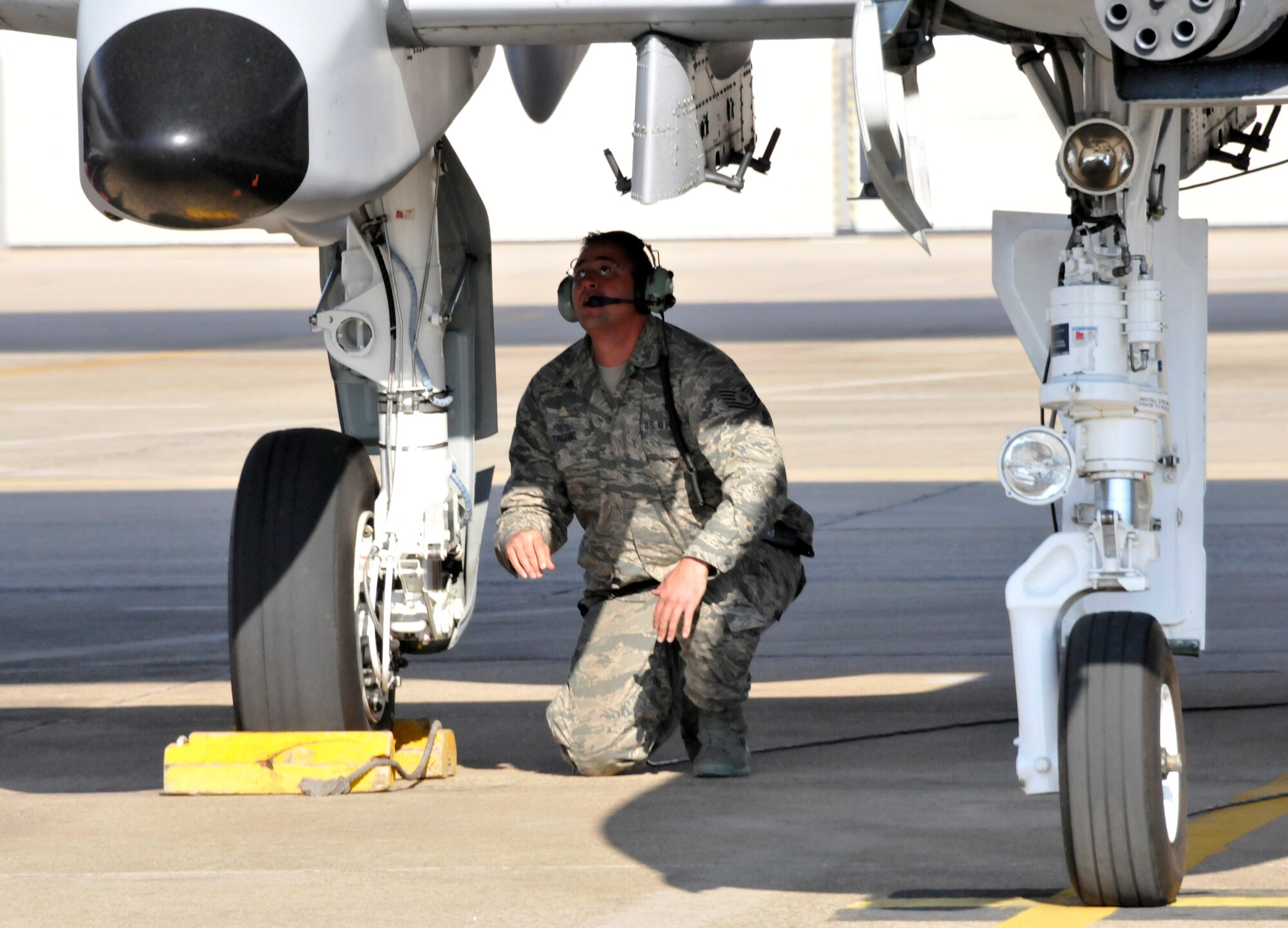 Tech Sgt. Shawn Thorne, a crew chief with the 188th Aircraft Maintenance Squadron, checks the brakes on an A-10C Thunderbolt II "Warthog" (Tail No. 586). The aircraft left Ebbing Air National Guard Base, Fort Smith, Arkansas. The aircraft was delivered from the 188th Fighter Wing to Moody Air Force Base, Georgia, April 18, 2014, as part of the 188th's mission conversion from the A-10 to a remotely piloted aircraft, intelligence and targeting mission. The 188th has three remaining A-10s on station. The final two aircraft are scheduled to leave the 188th June 7, 2014. (U.S. Air National Guard photo by Tech Sgt. Josh Lewis/Released)