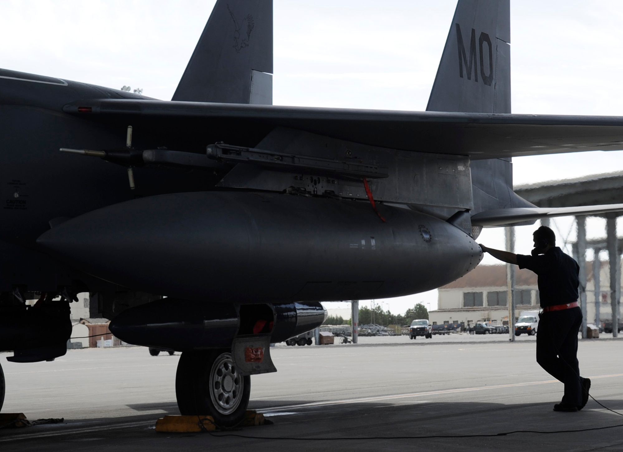 A crew chief from the 389th Fighter Squadron performs a pre-flight inspection, May 30, 2014, at Mountain Home Air Force Base, Idaho. Approximately ten F-15E Strike Eagles and hundreds of Airmen from the 366th Fighter Wing deployed to the Pacific Air Forces, demonstrating the U.S.s continued commitment to stability and security in the Asia-Pacific region. (U.S. Air Force photo by Senior Airman Caitlin Guinazu/Released) 
