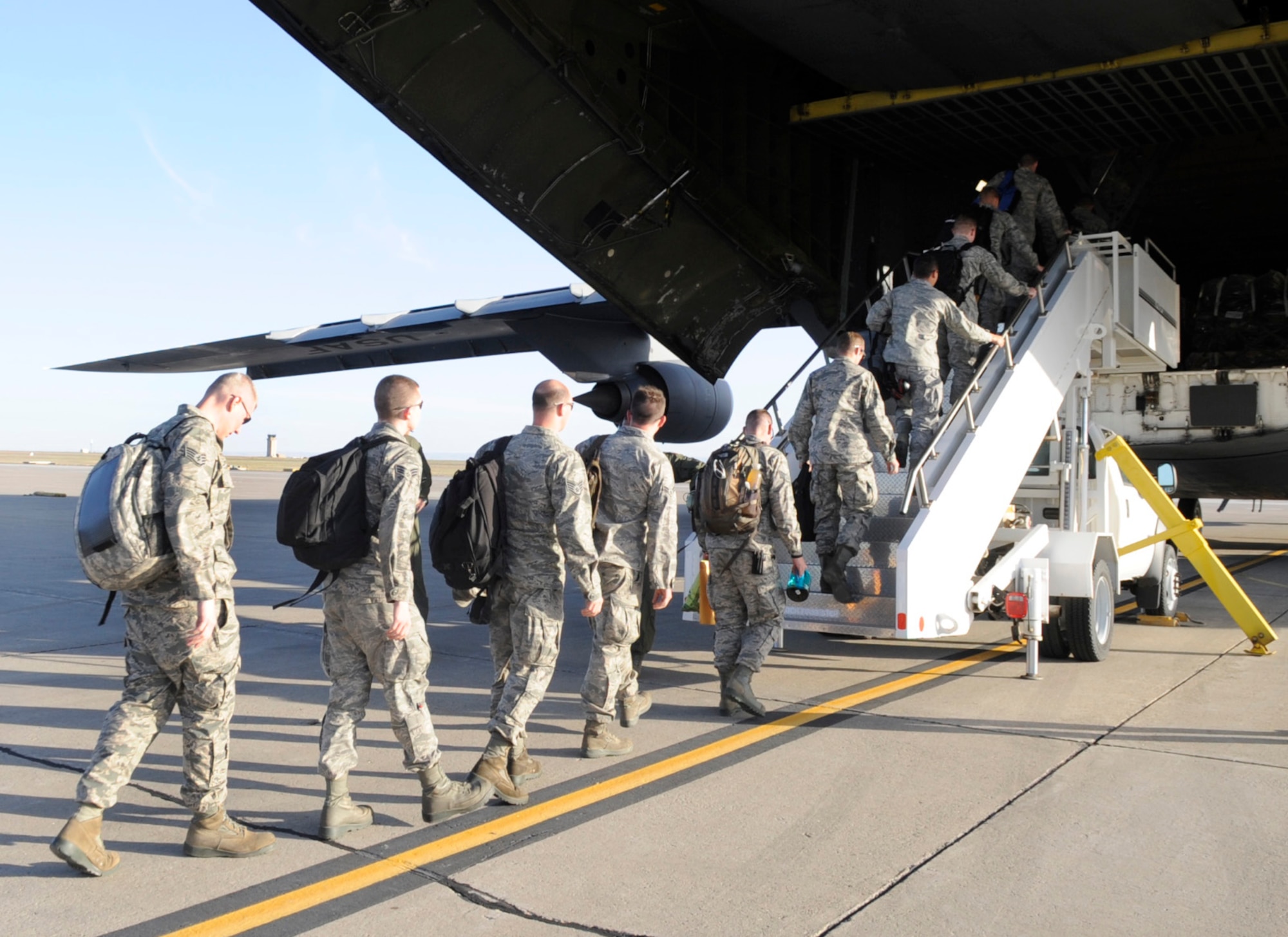Airmen from the 366th Fighter Wing load onto a C-5M Super Galaxy, May 29, 2014, at Mountain Home Air Force Base, Idaho. Aircrew, medical, logistics and maintenance personnel, as well as F-15E Strike Eagles from the 391st Fighter Squadron are deploying in support of the Pacific Air Forces and the U.S. Pacific Command. (U.S. Air Force photo by Senior Airman Caitlin Guinazu/Released) 