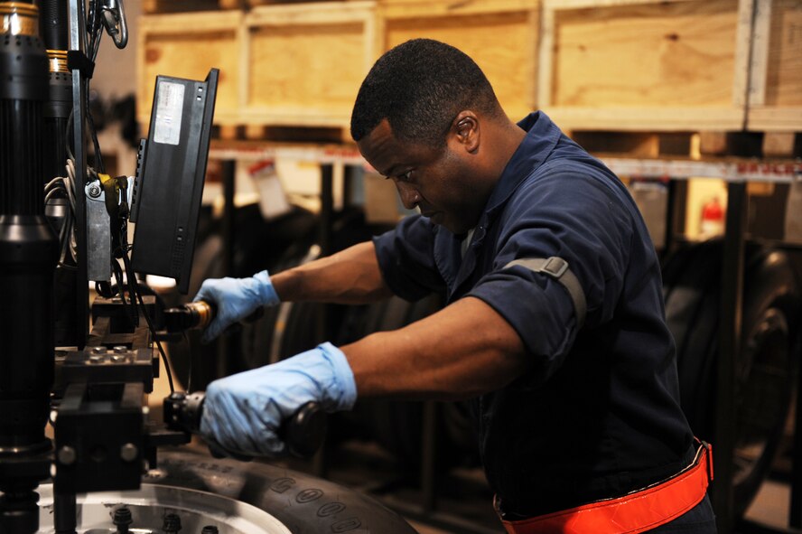 U.S. Air Force Chief Master Sgt. Eddie Webb, 7th Bomb Wing command chief, uses a torqueing machine to torque nuts onto an aircraft wheel April 29, 2014, at Dyess Air Force Base, Texas. Webb’s program, “Chief’s Turn to Learn,” offers Airmen the chance to show him what they do on a daily basis to accomplish the Air Force Mission. Webb shows up when they do, wears the same uniform, eats the same lunch, does the same hard labor and goes home when they do. (U.S. Air Force photo by Airman 1st Class Autumn Velez/Released)