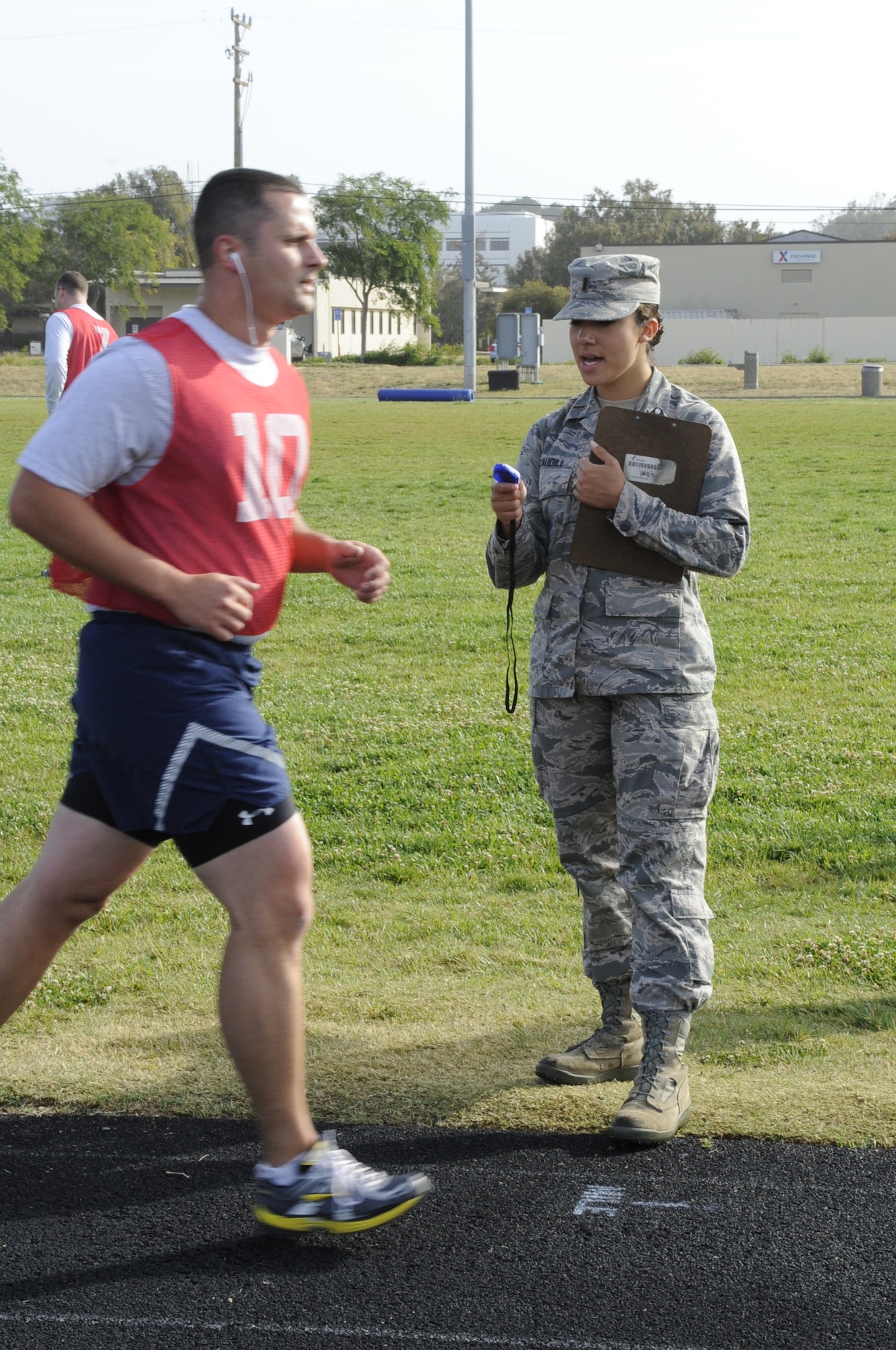 2nd Lt. Danielle Caudill, 30th Force Support Squadron fitness assessment cell officer-in-charge, conducts the cardio portion of an Official Fitness Assessment, May 29, 2014, Vandenberg Air Force Base, Calif. Understanding she plays a role in Airmen’s careers, Caudill remains dedicated to being fair and impartial. (U.S. Air Force photo by Senior Airman Shane M. Phipps/Released)

