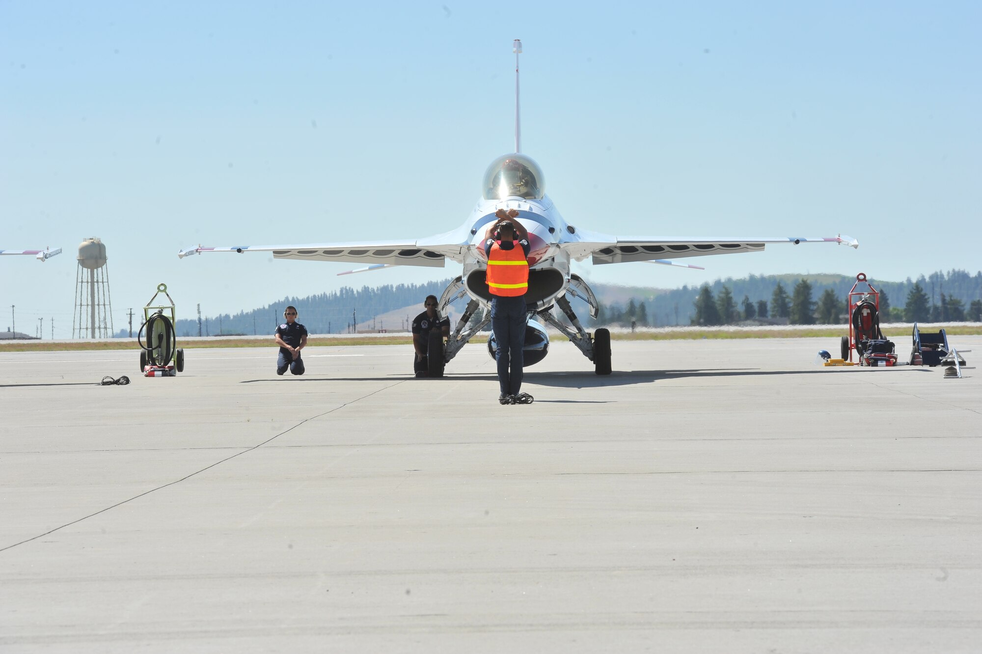The U.S. Air Force Thunderbirds F-16 Fighting Falcon prepares for take off from the flightline at Fairchild Air Force Base, Wash., May 30, 2014.  The flight was an orientation flight for Robyn Nance, KXLY news anchor, the day prior to SkyFest 2014.  (U.S. Air Force photo by Staff Sgt. Veronica Montes)