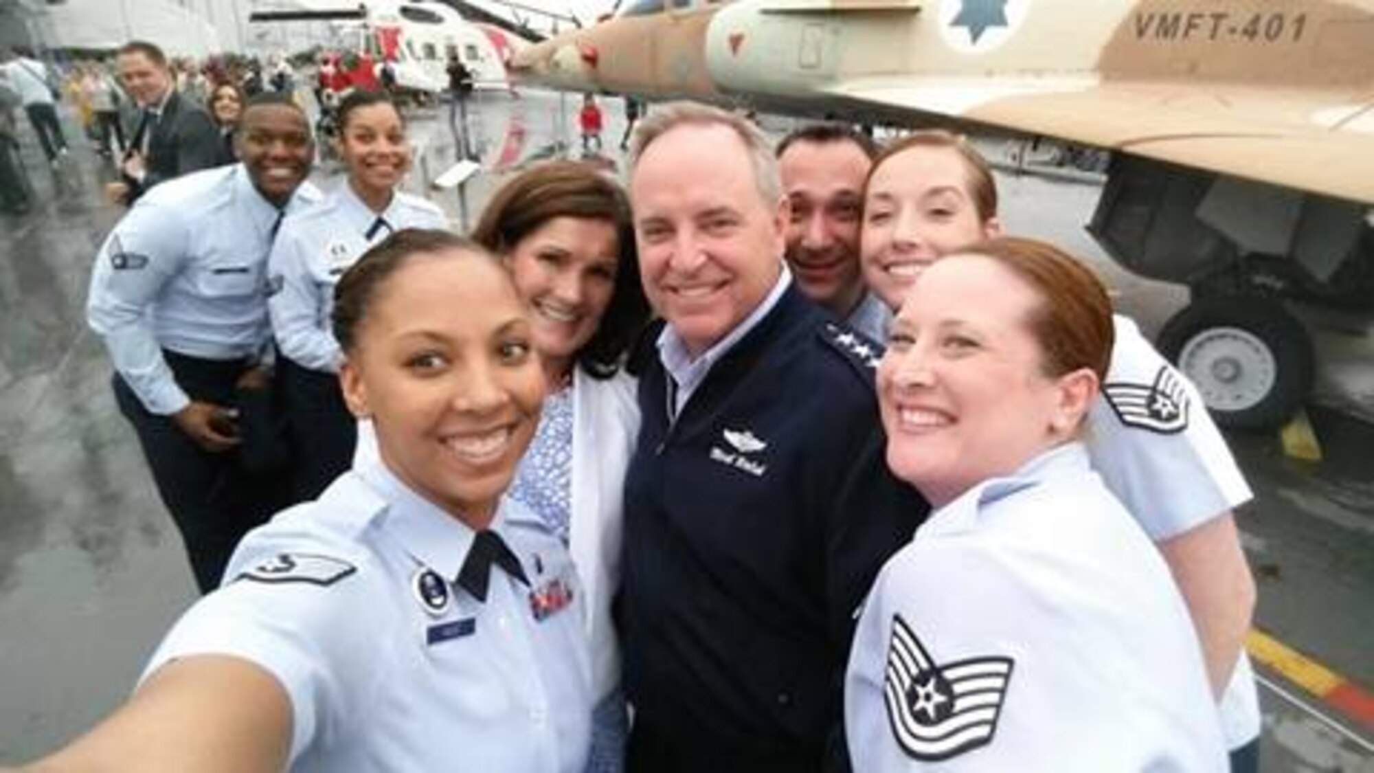 Recruiters from the 314th Recruiting Squadron gather around Air Force Chief of Staff Gen. Mark A. Welsh III for a photo May 15 aboard the USS Intrepid Sea, Air and Space Museum in New York City. At far left in the back are Senior Airman Darren Turner and Senior Airman Elizabeth Rivas, Jersey City, N.J., recruiters. At front left holding the camera is Staff Sgt. Keisha Hunt, Philadelphia recruiter; Betty Welsh and General Welsh; Tech. Sgt. Anthony Pasco, Hazelton, Pa., recruiter; Staff Sgt. Jessica Kosisky, line officer monitor in Burlington, N.J.; and at front right is Tech. Sgt. Jennifer Noll, operations NCO in Burlington, N.J. (U.S. Air Force photo/Staff Sgt. Keisha Hunt)