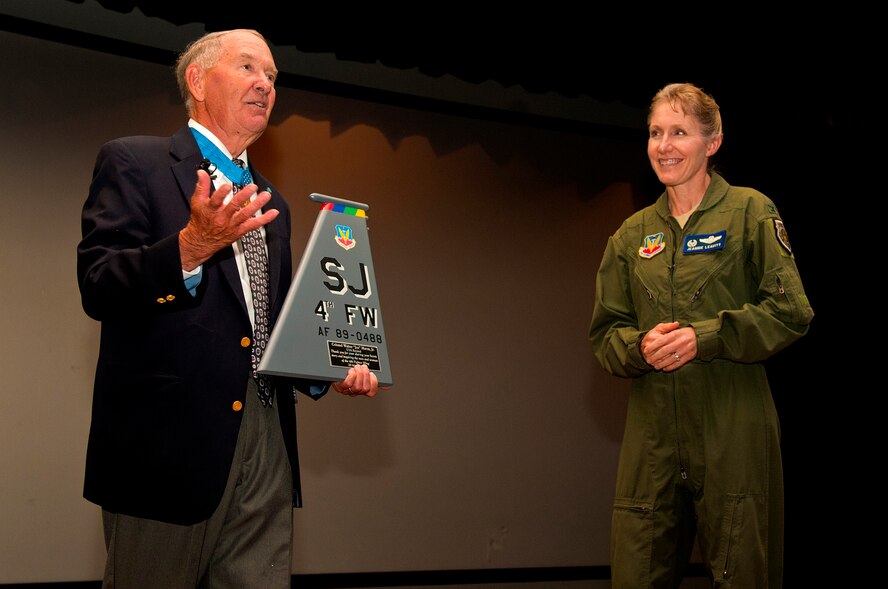 Walter “Joe” Marm Jr., retired U.S. Army Col. and Medal of Honor recipient (left) receives a tail flash from Col. Jeannie Leavitt, 4th Fighter Wing commander, in appreciation for speaking at the 4th FW Commander’s Leadership Lecture Series, May 28, 2014, at Seymour Johnson Air Force Base, North Carolina. Marm spoke about his time in combat during Vietnam and the leadership skills he exhibited to his soldiers. (U.S. Air Force photo/Airman 1st Class Shawna L. Keyes)