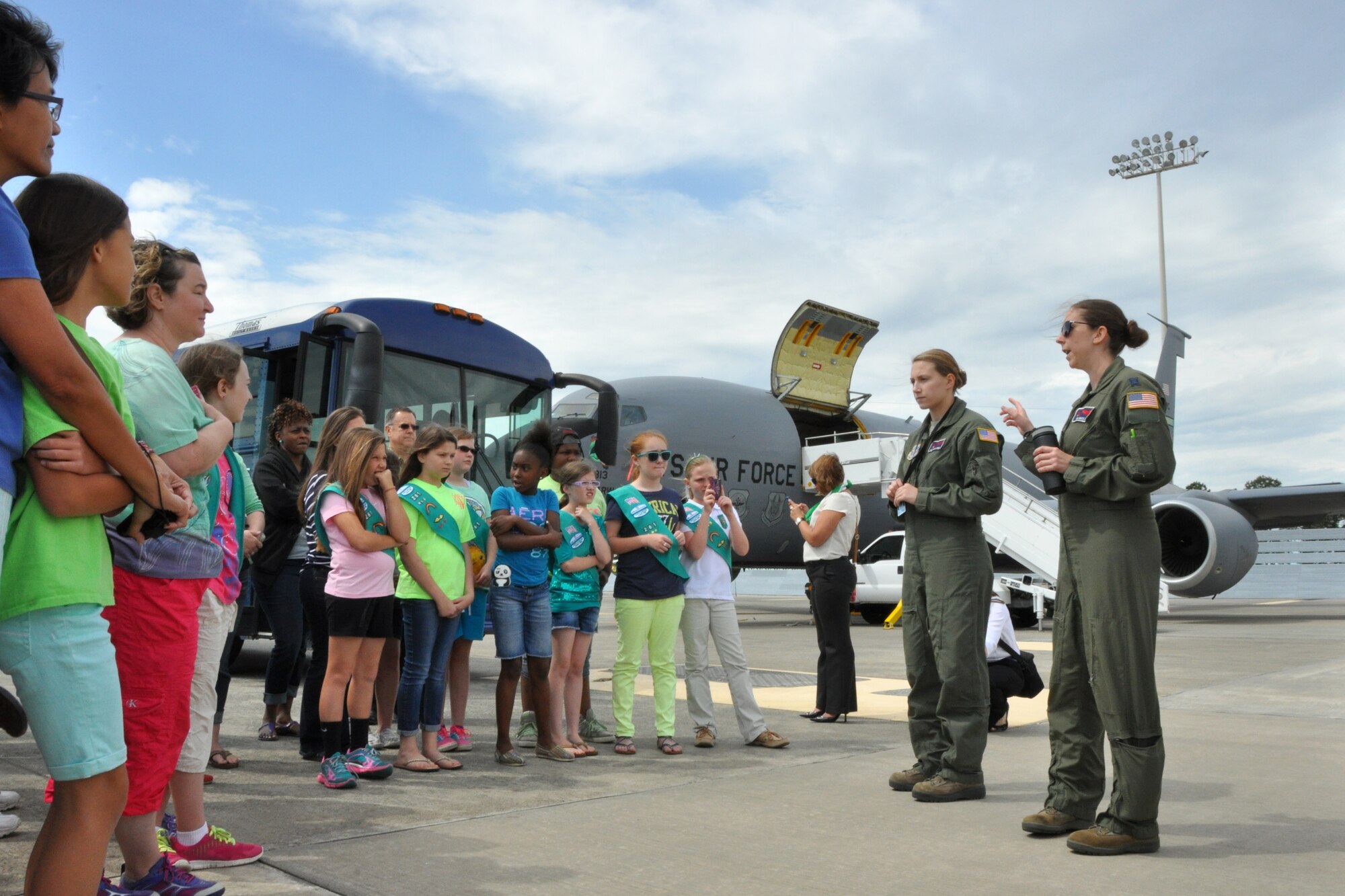 Girl Scouts from eastern North Carolina learn about the KC-135R Stratotanker aircraft while speaking with Capt.Tina Matejik, 916th Air Refueling Wing pilot, and  Airman 1st Class Shelby Yenke, 916th ARW boom operator.*Girl Scouts of America is a private organization and has no governmental status. The appearance of this photo does not constitute endorsement by the U. S. Government or the U. S. Air Force. (U.S. Air Force photo/ Master Sgt. Wendy Lopedote)