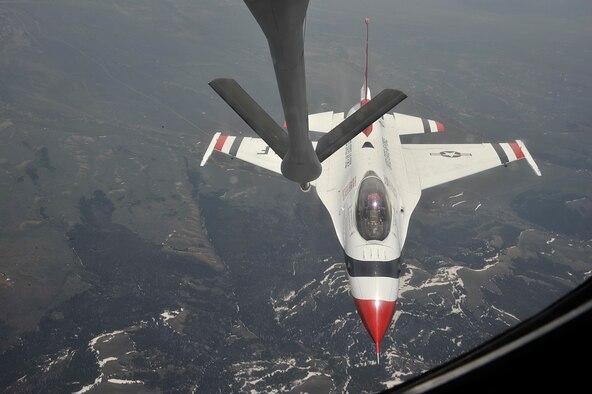 A U.S. Air Force Thunderbird approaches the boom of a KC-135 Stratotanker to receive fuel over Colorado, May 29, 2014. The KC-135 escorted the Thunderbird team to it's home station at Fairchild Air Force Base, Wash., in preparation for Skyfest 2014, Fairchild's open house. (U.S. Air Force photo/Senior Airman Mary O'Dell)