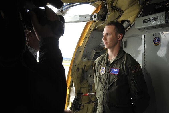 Senior Airman Cameron Bilyeu performs an on-camera interview for a local media agency at Fairchild Air Force Base, Wash., May 29, 2014. Local media members received an orientation flight including in-air refueling of the U.S. Air Force Thunderbirds while escorting the team to Fairchild in preparation for SkyFest 2014. Bilyeu is a 93rd Air Refueling Squadron boom operator. (U.S. Air Force photo/Senior Airman Mary O'Dell)