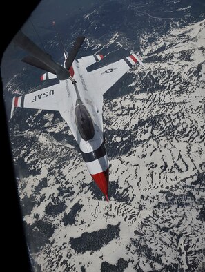 A U.S. Air Force Thunderbird attaches to the boom of a KC-135 Stratotanker to receive fuel mid-air over Colorado, May 29, 2014. The KC-135 escorted the Thunderbird team to it's home station at Fairchild Air Force Base, Wash., in preparation for SkyFest 2014, Fairchild's open house and air show. (U.S. Air Force photo/Senior Airman Mary O'Dell)