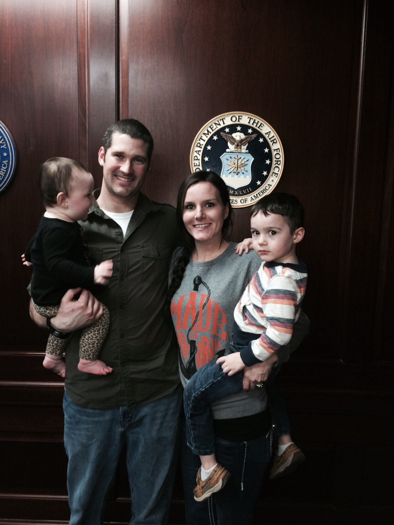 Tech. Sgt. Shaun McGlynn is shown with his family Feb. 21 when his wife, Kyrie, swore into the Delayed Entry Program at the Military Entrance Processing Station. With them are their daughter, Harper, and son, Emerson. (Courtesy photo)