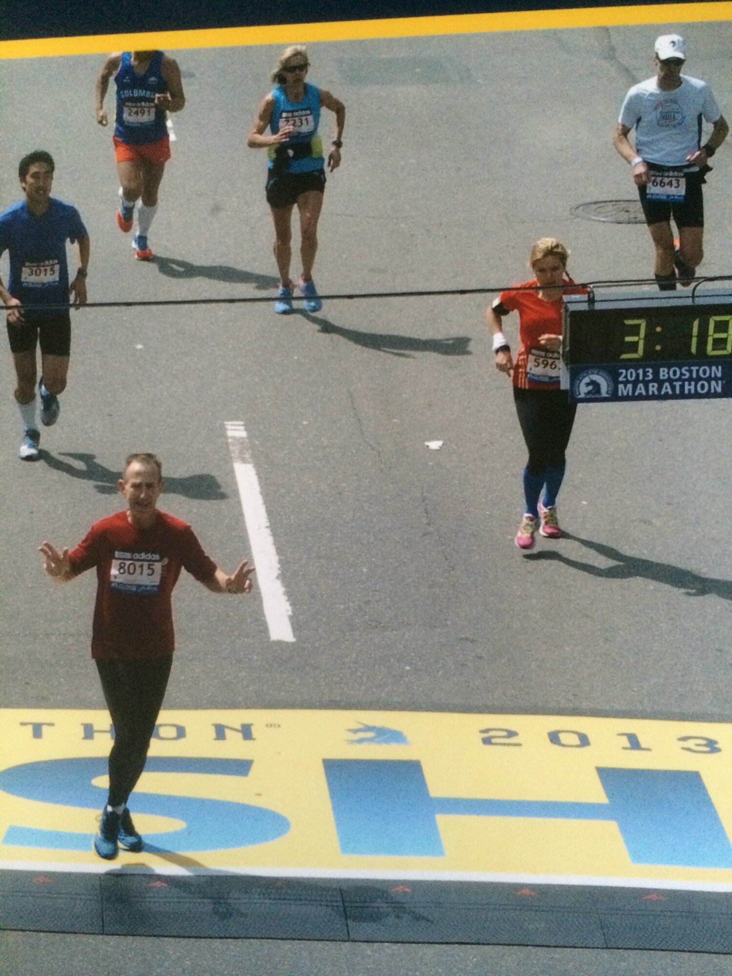 Lary Nickell, 4th Operations Group security manager, crosses the finish line of the 2013 Boston Marathon, April 15, 2013, in Boston. Nickell finished with a time of 3:12:57, which qualified him for the 2014 Boston Marathon. (Courtesy photo)