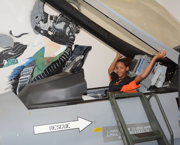 A member of the Junior Reserve Officer Training Corps, Madison Central High School, Madison, Mississippi, sits in a flight simulator, May 29, 2014, Naval Air Station Fort Worth Joint Reserve Base, Texas. The students are visiting the 301st Fighter Wing to learn about the different career fields the Air Force has to offer. (U.S. Air Force photo by Staff Sgt. Samantha A. Mathison)