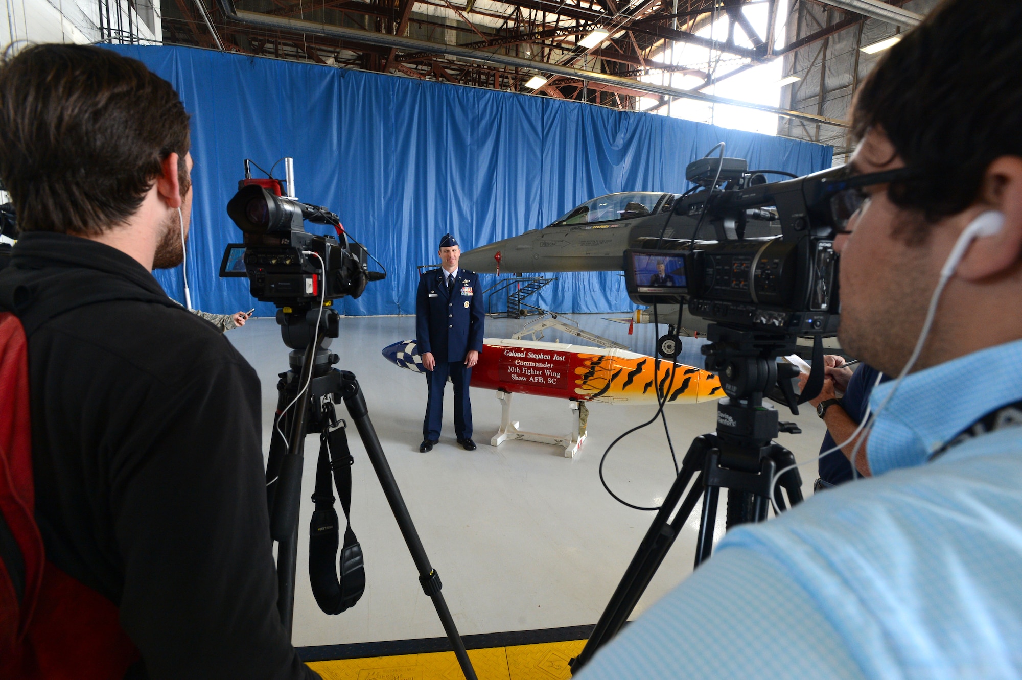 U.S. Air Force Col. Stephen Jost, 20th Fighter Wing commander, prepares for an interview with local news agencies after assuming command at Shaw Air Force base, S.C., May 30, 2014. The 20th FW is home to 82 F-16 Fighting Falcons, and 7,886 active duty Airmen. (U.S. Air Force photo by Airman 1st class Jensen Stidham/Released) 