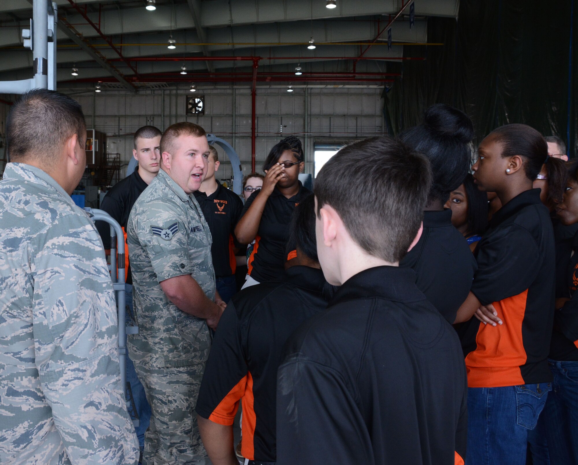 Senior Amn. Jared M. Campbell, 301st Maintenance Squadron jet engine technician, briefs students from Madison, Mississippi, May 29, 2014, Naval Air Station Fort Worth Joint Reserve Base, Texas. Members of the Junior Reserve Officer Training Corps, Madison Central High School, visit the 301st Fighter Wing to learn about the different career fields the Air Force has to offer. (U.S. Air Force photo by Staff Sgt. Samantha A. Mathison)