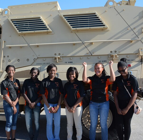 Members of the Junior Reserve Officer Training Corps, Madison Central High School, Madison, Mississippi, pose next to a convoy vehicle, May 29, 2014, Naval Air Station Fort Worth Joint Reserve Base, Texas. The students are visiting the 301st Fighter Wing to learn about the different career fields the Air Force has to offer. (U.S. Air Force photo by Staff Sgt. Samantha A. Mathison)