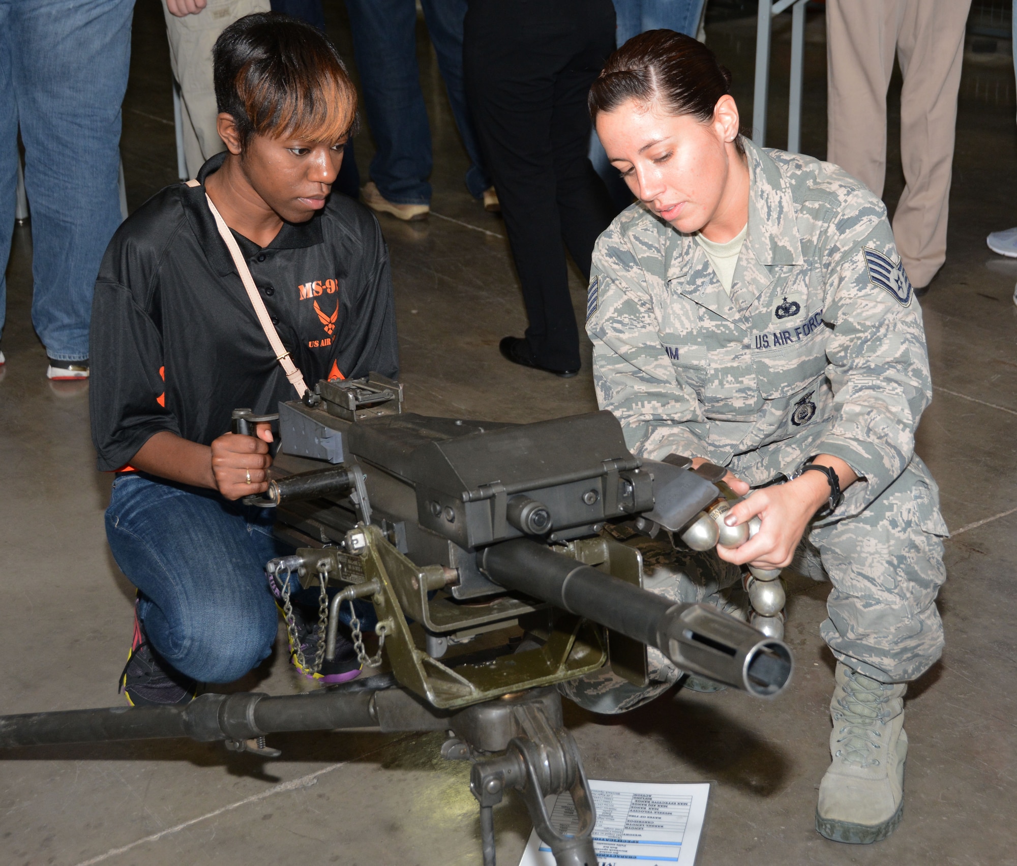 Staff Sgt. Martha L. Klemm, 610th Security Forces Squadron weapons instructor, instructs a student from Madison, Mississippi, May 29, 2014, Naval Air Station Fort Worth Joint Reserve Base, Texas. Members of the Junior Reserve Officer Training Corps, Madison Central High School, visit the 301st Fighter Wing to learn about the different career fields the Air Force has to offer. (U.S. Air Force photo by Staff Sgt. Samantha A. Mathison)
