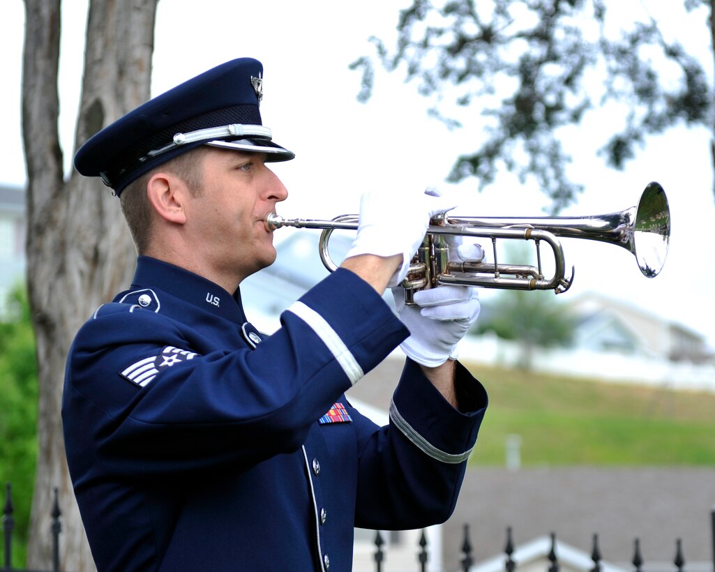 SSgt Carl Eitzen performing Taps at the Base Cemetery. Honoring the Veterans for Memorial Day