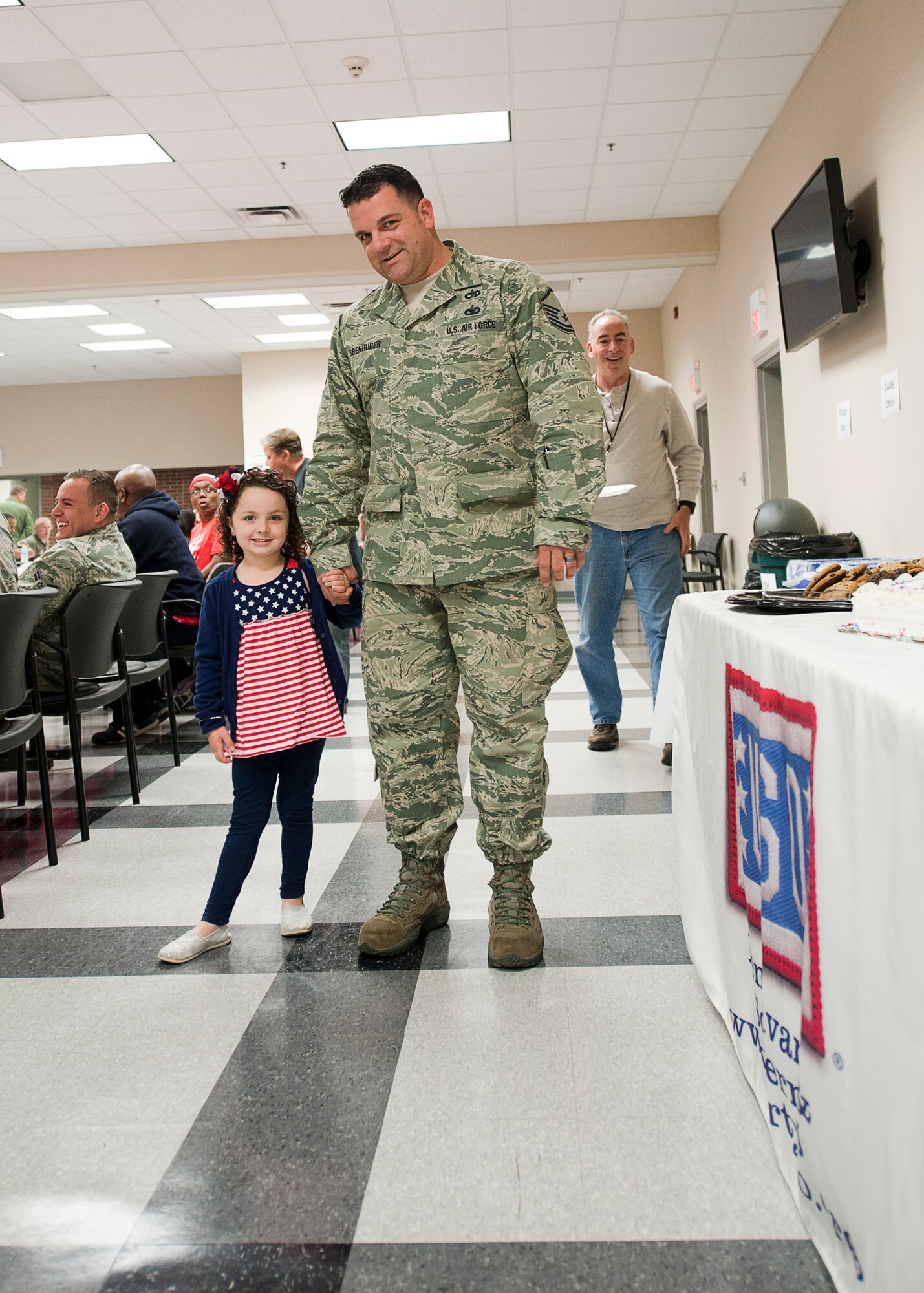Master Sgt. David Brenhuber, 88th Ariel Port Squadron, poses with his five-year-old daughter, Alexis during the 514th Air Mobility Wing's Hot Diggity Dog Day luncheon, May 29th, here (U.S. Air Force photo/Christian DeLuca). 