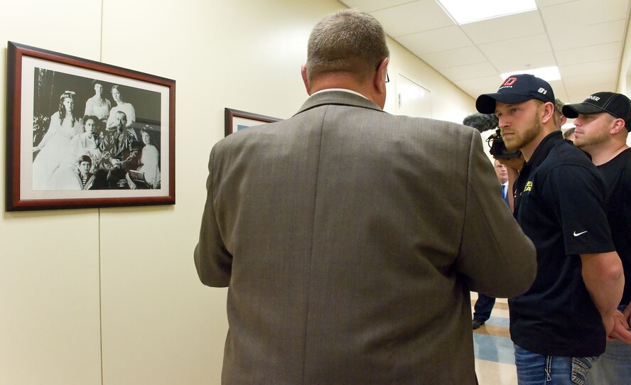Jeffrey Earnhardt, right, NASCAR Nationwide Series driver of the No. 4 JD Motorsports Chevrolet, listens to James Canik, Armed Forces Medical Examiner System deputy director for administration, facilities and support, Armed Forces DNA Identification Laboratory, May 28, 2014, at Dover Air Force Base, Del. Earnhardt was briefed on how DNA was used to identify members of the Romanov family, Tsar Nicholas II, his wife Alexandra and their children. (U.S. Air Force photo/Roland Balik)