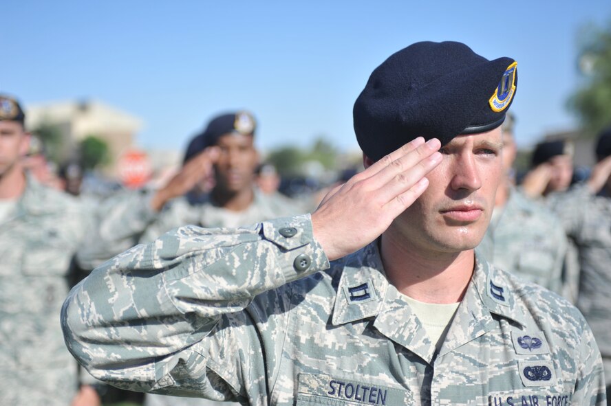 Capt. Andrew Stolten, 56th Security Forces Squadron security operations officer, renders a salute May 15 during the lowering of the flag at the S.S. Mayaguez retreat ceremony at Luke Air Force Base. The retreat was part of National Police Week May 11 through 17. (U.S. Air Force photo/Senior Airman Jason Colbert