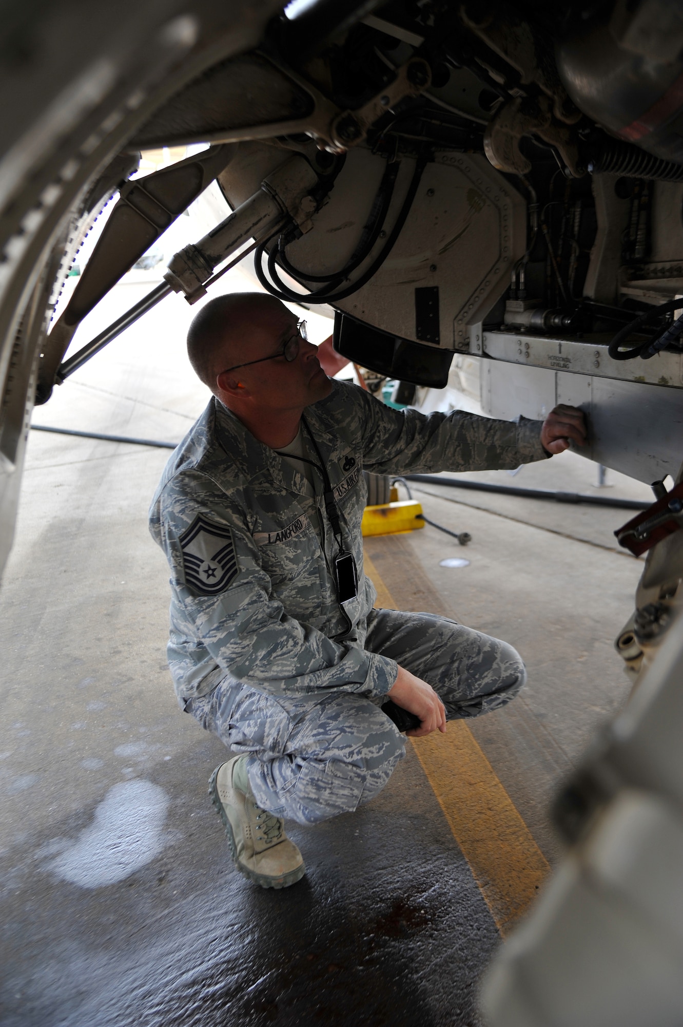 Senior Master Sgt. Todd Langford, 310th AMU assistant superintendent, performs a spot check on an F-16. Langford’s daily duties include being on the flightline to check aircraft and speak to Airmen performing the mission. (U.S. Air Force photo/Senior Airman Jason Colbert)