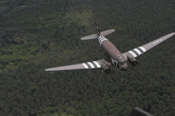 A Douglas C-47 Skytrain, known as Whiskey 7, flies over Germany, May 30, 2014. The C-47 came to Ramstein for a week to participate in base activities with its legacy unit, the 37th Airlift Squadron, before returning to Normandy to recreate its role and drop paratroopers over the original drop zone in Sainte-Mere Eglise, France. (U.S. Air Force photo/Staff Sgt. Sara Keller)