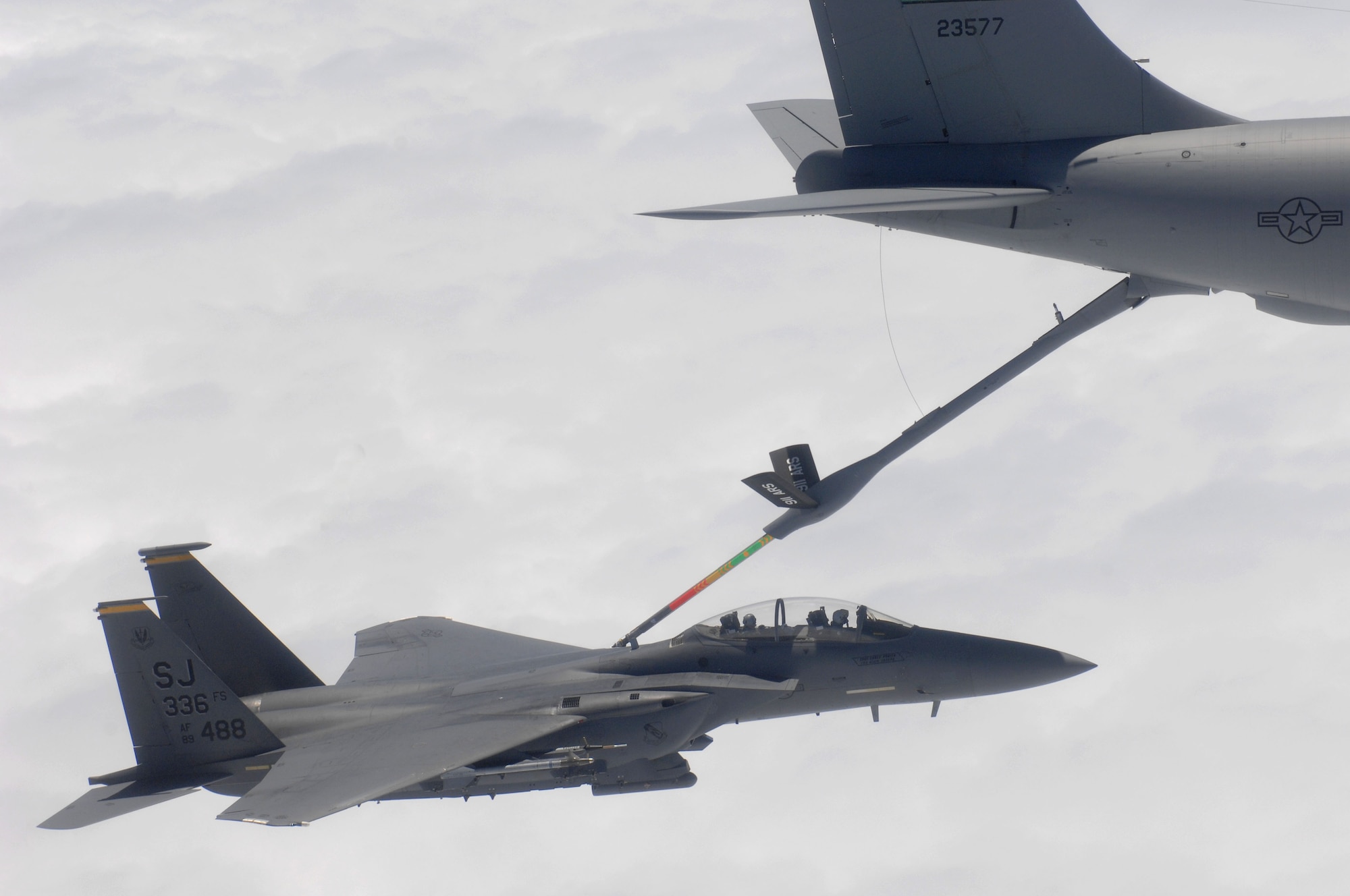 A KC-135R Stratotanker aircraft refuels an F-15E Strike Eagle piloted by Col. Jeannie Leavitt, 4th Fighter Wing commander, during her fini-flight, May 28, 2014, near Seymour Johnson Air Force Base, North Carolina. A fini-flight is a military aviation tradition that marks the end of a pilot’s or commander’s time at a location or command. (U.S. Air Force photo/Maj. Luke Ball)

