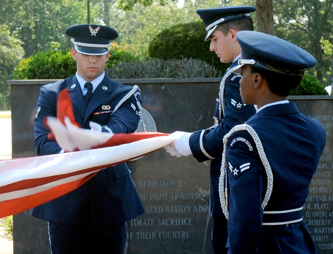 Columbus Air Force Base Honor Guard Airmen fold the U.S. flag during a Memorial Day retreat ceremony on base, May 22. Decoration Day originated after the American Civil War to commemorate the Union and Confederate soldiers who had died. Since then, Memorial Day has become a day to remember all military members who have fallen in the line of duty. (U.S. Air Force photo/ Sharon Ybarra)