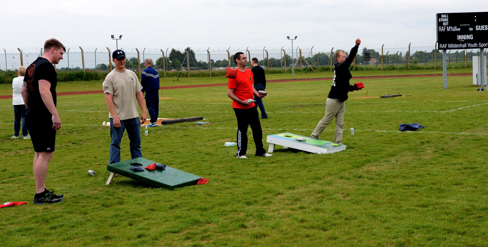 Members of the 100th Mission Support Group play Cornhole during the 100th MSG sports day May 30, 2014, at Heritage Park on RAF Mildenhall, England. The 100th MSG sports day allowed different squadrons to come together and raise morale by playing various sport activities. (U.S. Air Force photo/Airman 1st Class Kelsey Waters/Released)