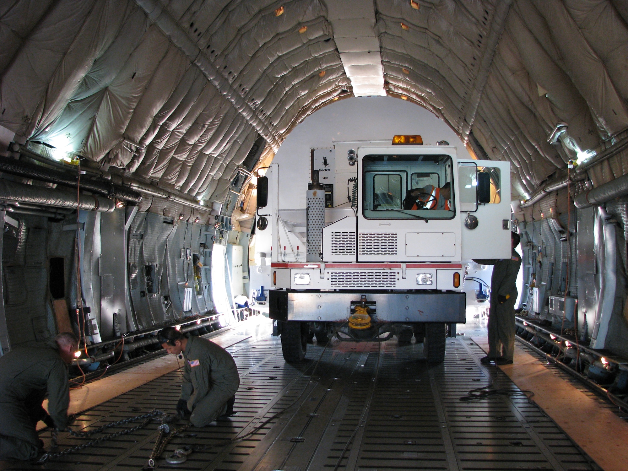 Travis loadmasters load a Space Container Transportation System onto a C-5C Space Cargo Modified Galaxy. “They can do any other C-5 mission except carry passengers, but are special because of the vital payloads only they can carry,” said Staff Sgt. Will Harden, 22nd Airlift Squadron evaluator loadmaster. (U.S. Air Force photo/ Master Sgt. Steven Edmundson)