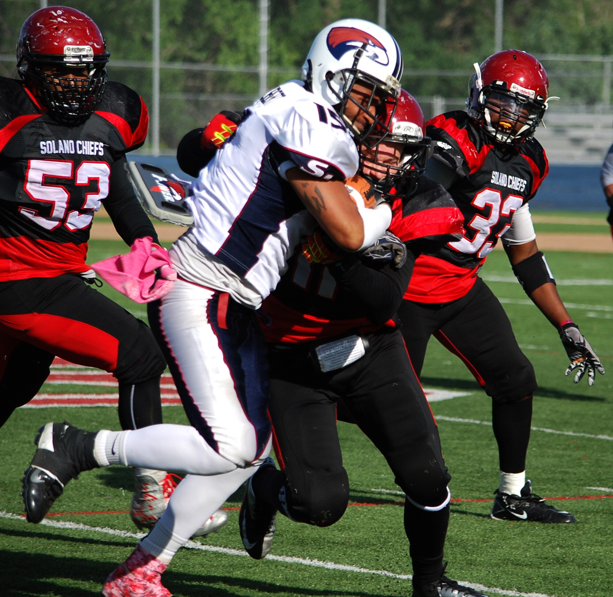 Senior Airman Cody Walters, 60th Medical Support Squadron medical logistics technician, tackles an offensive player on the San Jose Eagles May 10, 2014, resulting in a 24-21 win. Walters serves as the Solano Chiefs leading tackler and defensive captain. (Photo by Sandra Eaton)