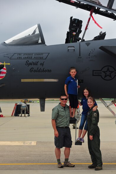 Col. Jeannie Leavitt, 4th Fighter Wing commander, and her family stand by the wing flagship after her fini-flight, May 29, 2014, at Seymour Johnson Air Force Base, North Carolina.  Leavitt will relinquish command of the 4th FW June 2, and transition to her next assignment as the principal military assistant to the Secretary of Defense.  (U.S. Air Force photo/Airman 1st Class Brittain Crolley)