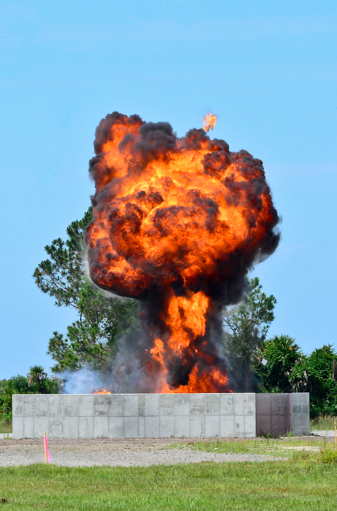Explosives are detonated during joint training at the explosive ordnance disposal range May 28, 2014, at MacDill Air Force Base, Fla. More than 60 TSA officers visited the EOD range for this training during two visits over the past week. (U.S. Air Force photo by Airman 1st Class Ned T. Johnston/Released)