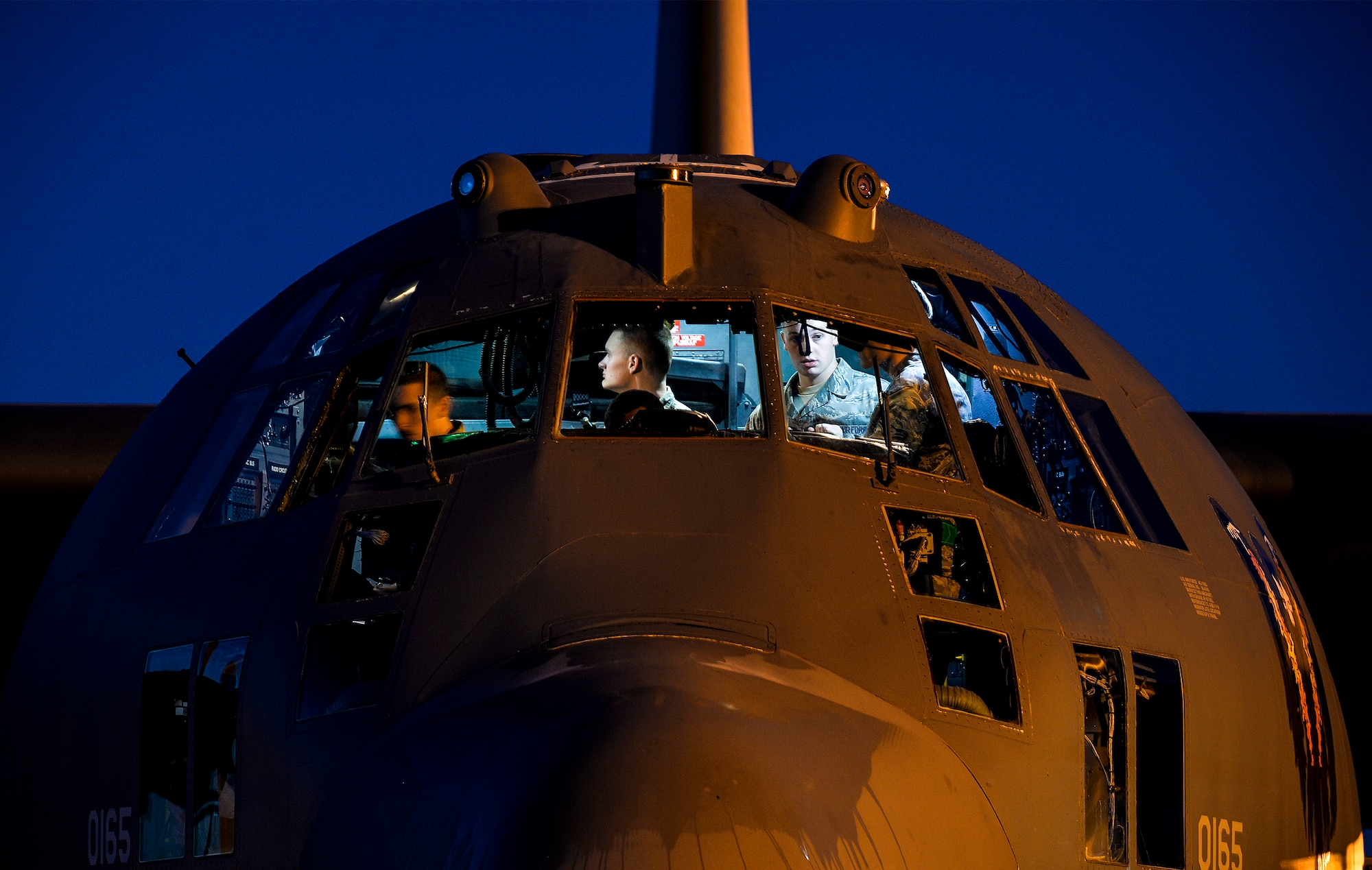 Flight control specialist journeymen from the 4th Aircraft Maintenance Unit work on an AC-130U Spooky Gunship  at Hurlburt Field, Fla., May 16, 2014. The 4th AMU maintains the aircraft 24 hours a day to ensure the training missions go as planned. (U.S. Air Force photo/Senior Airman Christopher Callaway) 
