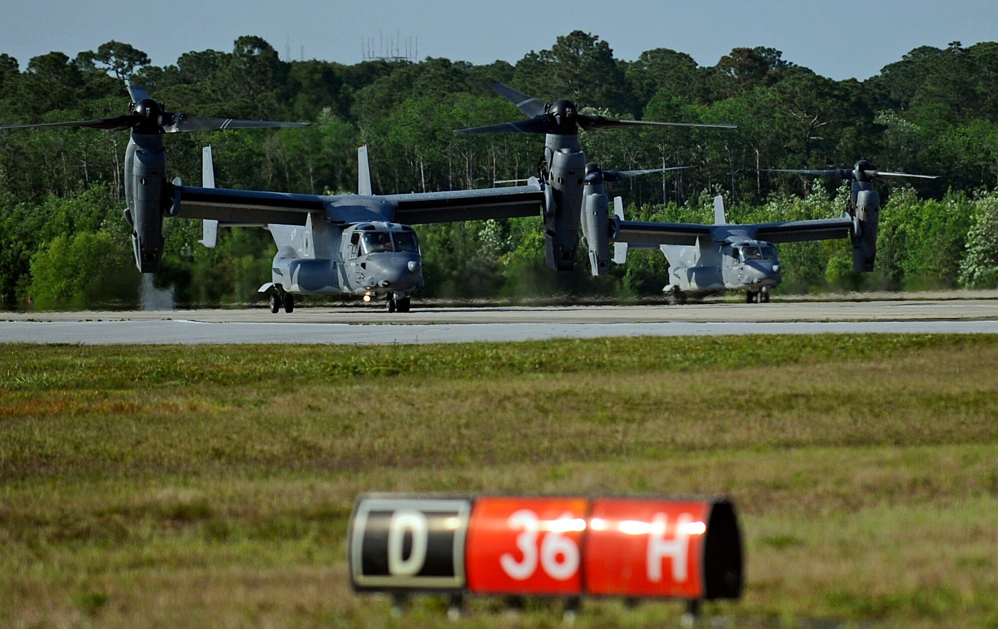 CV-22 Osprey’s taxi at Hurlburt Field, Fla. May 20, 2014. The Osprey, left, had to be refueled prior to its training mission. (U.S. Air Force photo/Staff Sgt. Jeff Andrejcik)