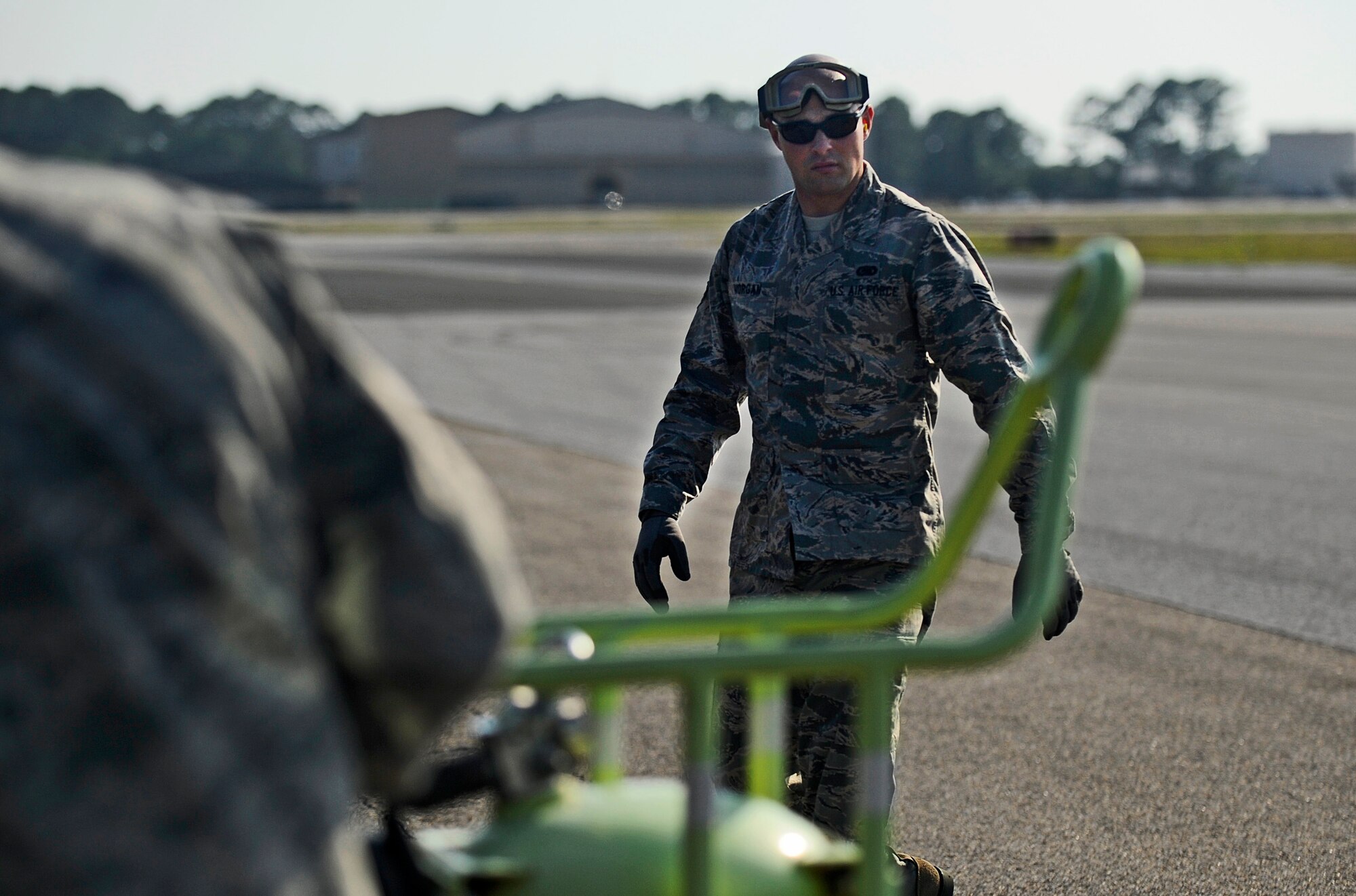 Senior Airman Johnathan Morgan, 1st Special Operations Logistics Readiness Squadron fuels journeyman, prepares equipment for a refuel at Hurlburt Field, Fla., May 20, 2014. The Petroleum, Oils and Lubricants flight is responsible for transporting and dispensing thousands of gallons of fuel weekly at Hurlburt Field. (U.S. Air Force photo/Staff Sgt. Jeff Andrejcik)