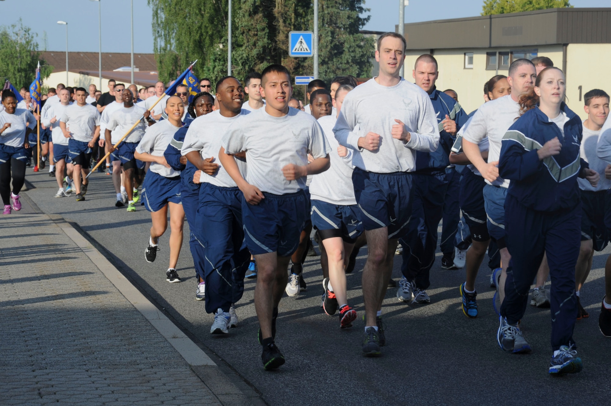 U.S. Air Force Airmen from the 52nd Fighter Wing participate in a formation run May 29, 2014, at Spangdahlem Air Base, Germany. Airmen ran 1.5-miles with their squadrons to kick off wing sports day. (U.S. Air Force photo by Airman 1st Class Dylan Nuckolls/Released)