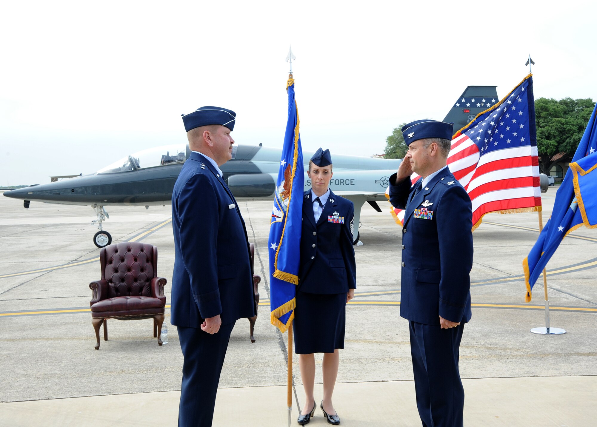 Col. Brian "Bowwow" Bowman prepares to accept command of the 340th Flying Training Group from Maj. Gen. Mark A. Kyle, 22nd Air Force commander, during an assumption of command ceremony at Joint Base San Antonio-Randolph, Texas, May 2. (U.S. Air Force photo)