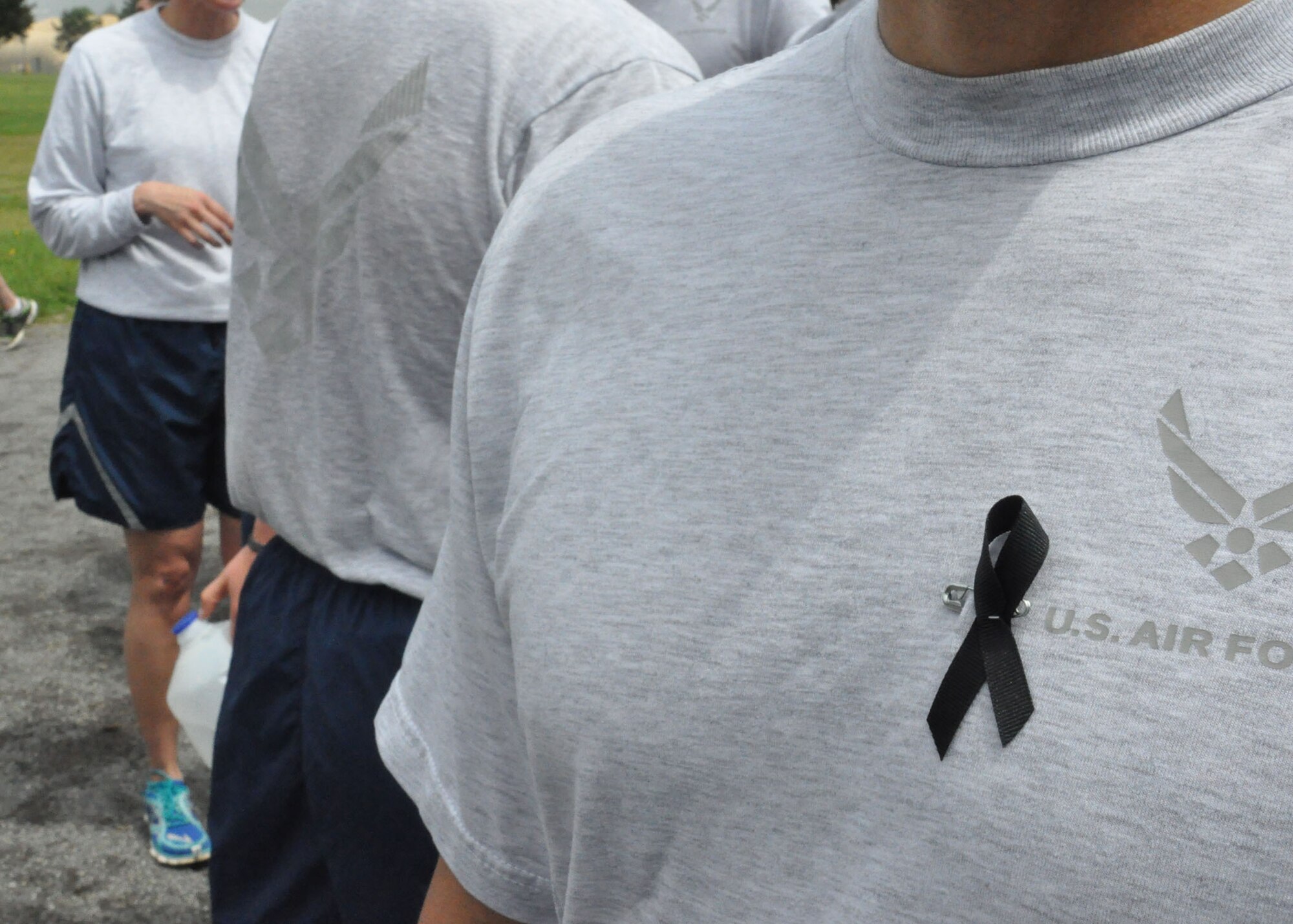 Participants wore black ribbons to honor the memory of deceased aerial porters during the the first annual "Port Dawg" memorial event May 22.