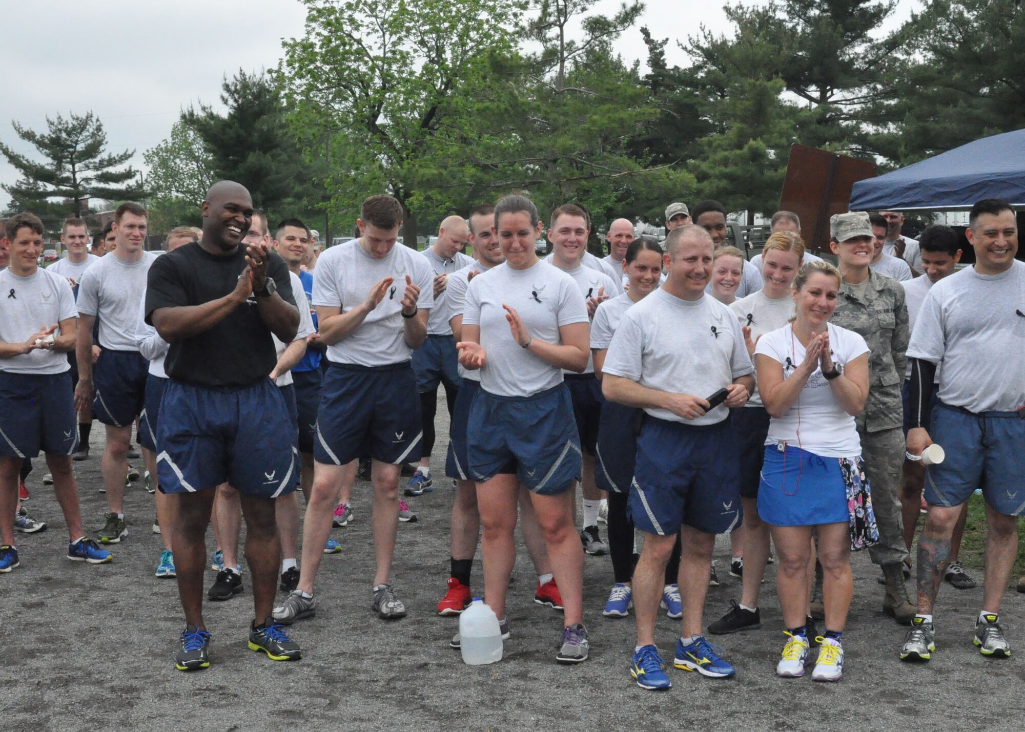 Joint Base McGuire-Dix-Lakehurst airmen applaud after the first annual "Port Dawg" memorial run May 22. The career field wide event honored the memory of deceased aerial porters.
