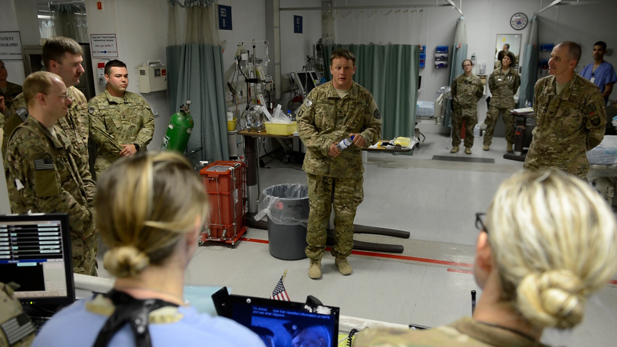 U.S. Army Sgt. 1st Class Joshua Olson, 1st Battalion, 187th Infantry Regiment, Fort Benning, Ga. speaks to Craig Joint Theater Hospital medical staff during Operation Proper Exit at Bagram Airfield, Afghanistan May 28, 2014. The program is intended to gain a sense pride and closure for soldiers severely injured in the line of duty.  Olson is currently on active duty and is a native of Spokane, Wash.  (U.S. Air Force photo by Staff Sgt. Evelyn Chavez/Released)