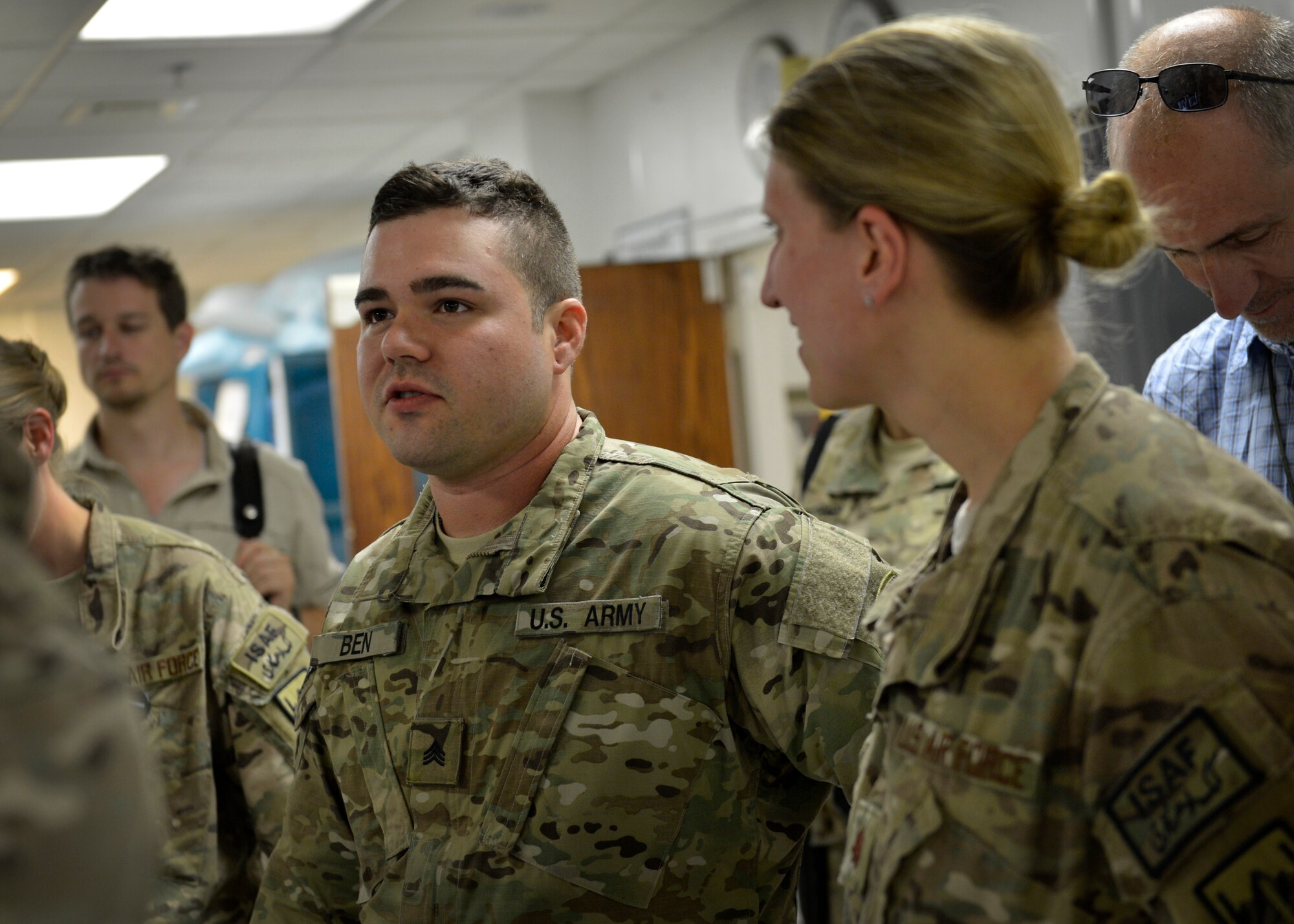 U.S. Army Sgt. Joshua Ben, speaks with the medical staff of Craig Joint Theater Hospital during Operation Proper Exit at Bagram Airfield, Afghanistan May 28, 2014.  Operation Proper Exit allows soldiers who were injured in the line of duty to return to the area, come to terms with what happened, find closure, and leave again, this time on their own terms. Ben is currently retired a and a native of Sturgeon, Missouri. (U.S. Air Force photo by Staff Sgt. Evelyn Chavez/Released)