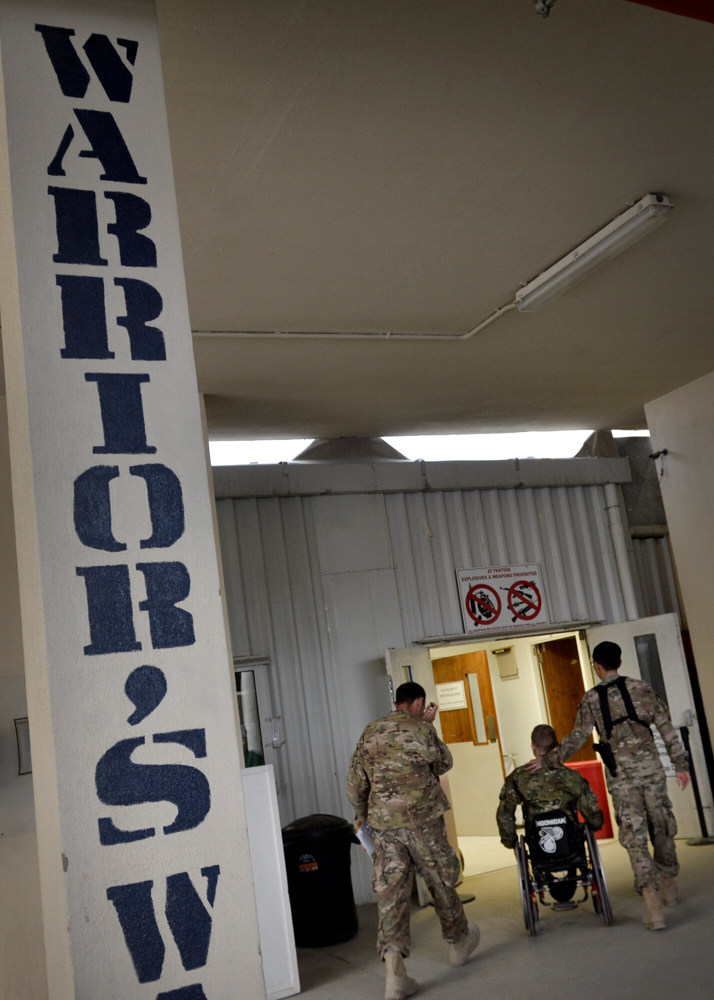 Airmen from the Craig Joint Theater Hospital escort U.S. Army Ret. Sgt. Brendan Marrocco during Operation Proper Exit at Bagram Airfield, Afghanistan May 28, 2014.  Operation Proper Exit allows soldiers who were injured in the line of duty to return to the area, come to terms with what happened, find closure, and leave again, this time on their own terms. Marrocco is currently retired and a native of Staten Island, New York. (U.S. Air Force photo by Staff Sgt. Evelyn Chavez/Released) (Image cropped)