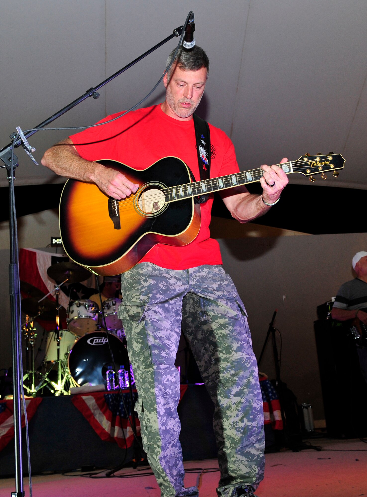 Country music artist, Darryl Worley performs for Service members at Al Udeid Air Base, Qatar, May 25, 2014. Worley, along with his band, were part of a Morale Welfare Recreation Memorial Day weekend tour and also performed at Camp As Sayliyah. (U.S. Air Force photo by Senior Airman Colin Cates)
