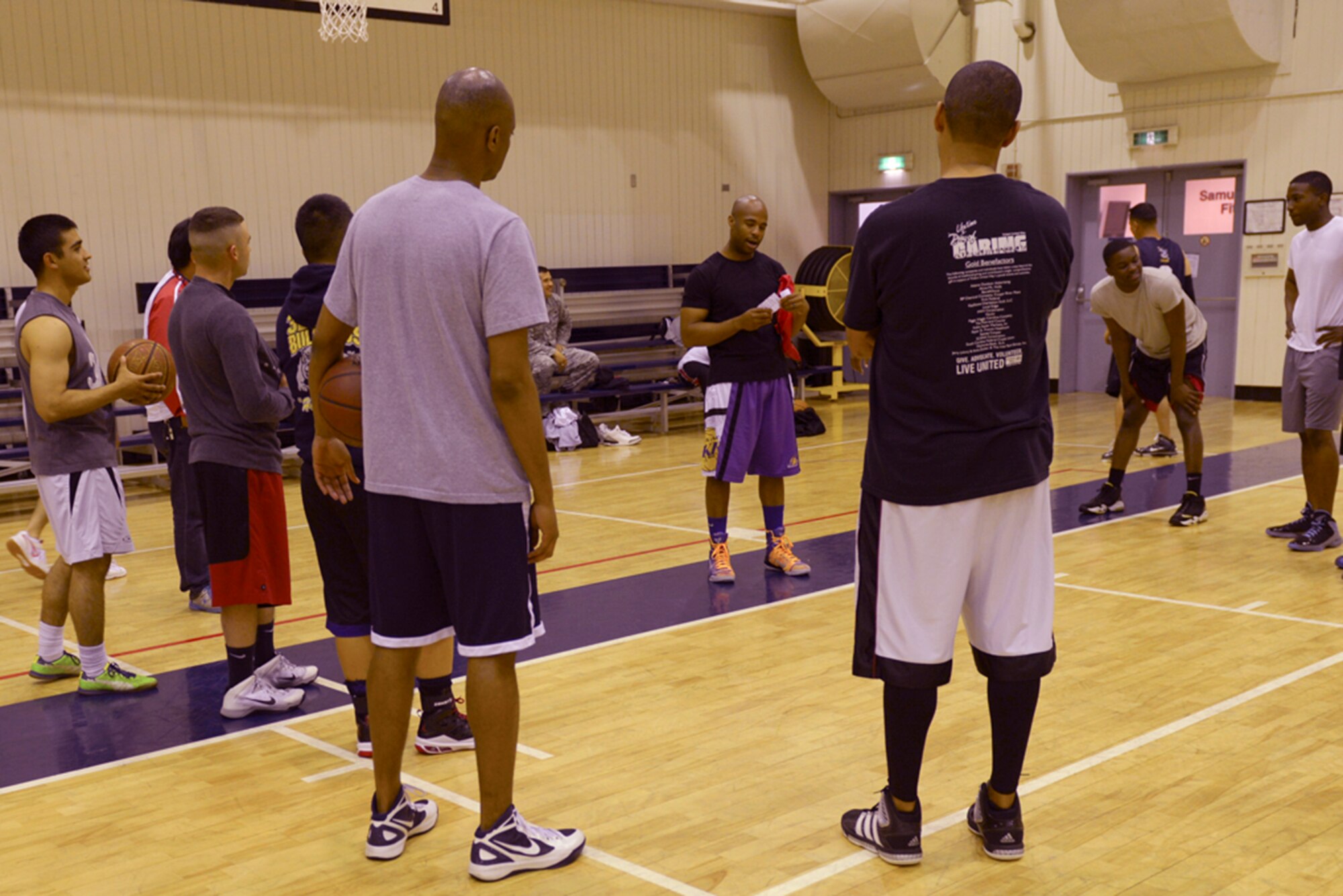 Staff Sgt. Jabrai Trueluck, 374th Security Forces Squadron NCO in charge of reports and analysis, briefs team captains on basketball tournament rules at Yokota Air Base, Japan, May 21, 2014. The tournament had seven competing teams spanning the 374th Security Forces Squadron, the 374th Communications Squadron and the Fussa police department. (U.S. Air Force photo by Airman 1st Class David Danford/Released)